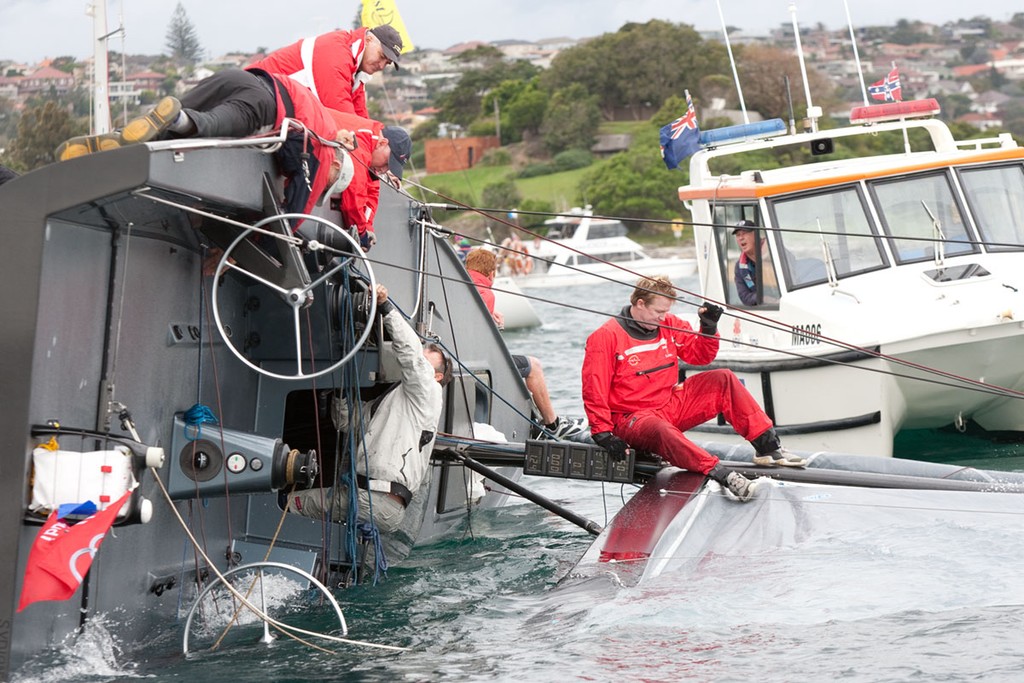 NSW Maritime standing by capsized Q. - Audi Winter Series 2011 © www.SailPix.com.au http://www.SailPix.com.au